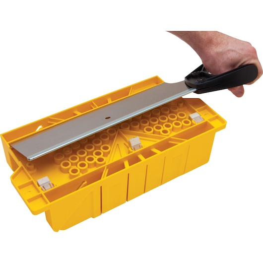 Photo of STANLEY 20-600 yellow plastic miter box with saw, top angle.