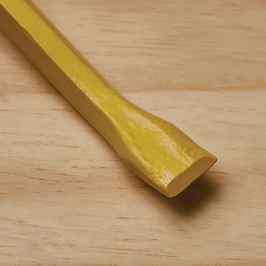 Stanley 55-118 yellow pry bar end on wood surface, close-up photography, tool category.
