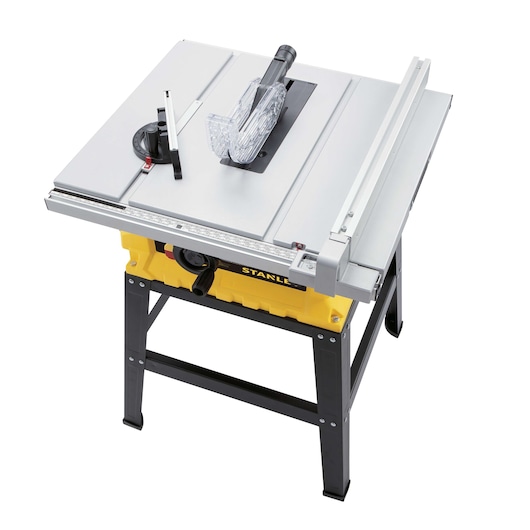 Photo of STANLEY SST1801-B3 table saw with yellow base, black legs, silver top, and clear blade guard, angled view.