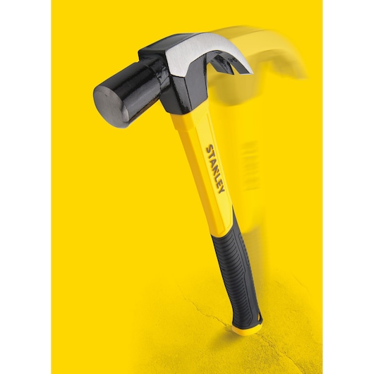 STANLEY STHT51391 yellow and black claw hammer with ergonomic grip, front angle, on yellow background.