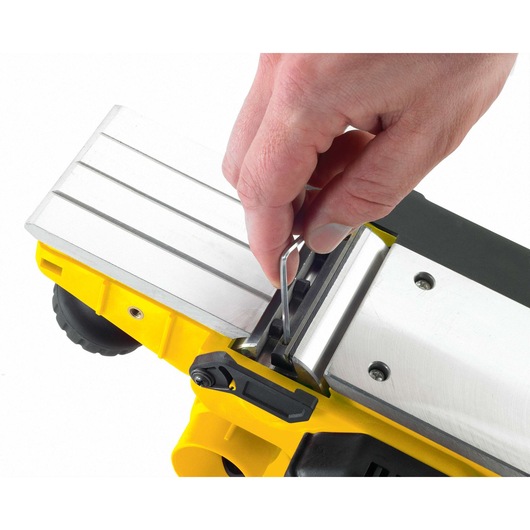 STANLEY STPP7502-B2 yellow planer showing blade adjustment from top angle