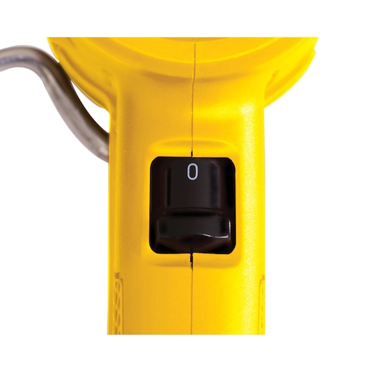 Close-up front view of STANLEY STXH2000K heat gun black power switch on yellow body.
