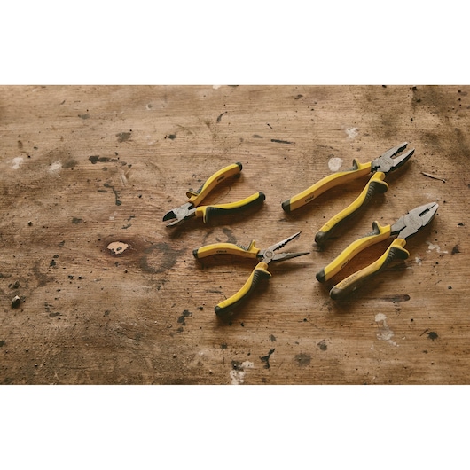 STANLEY 84-054LA pliers set with yellow handles on a rustic wooden surface, product top view